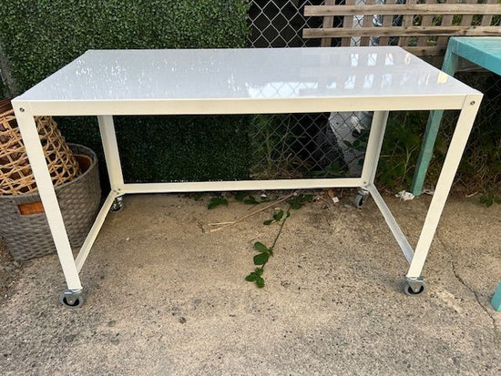 CB2 white powder coated table on wheels